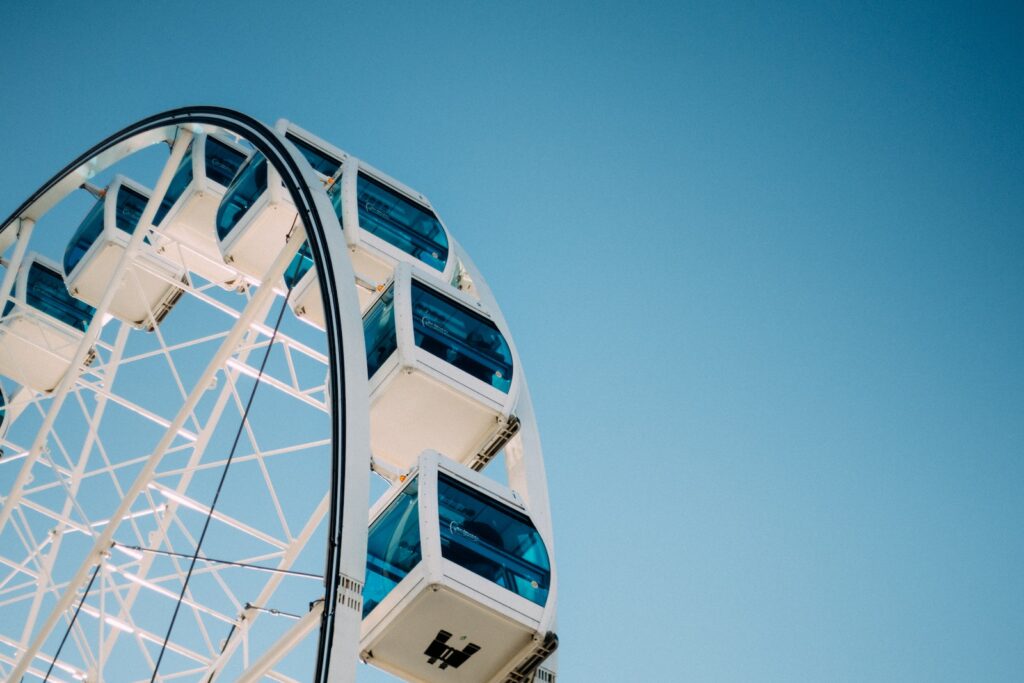 Blue and White Ferries Wheel Under Blue Skies