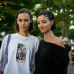 A couple of women standing next to each other