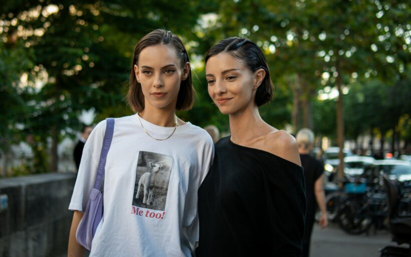 A couple of women standing next to each other