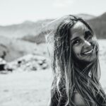 smiling woman look behind