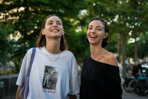 A couple of women standing next to each other