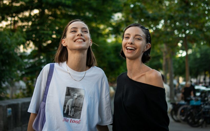 A couple of women standing next to each other