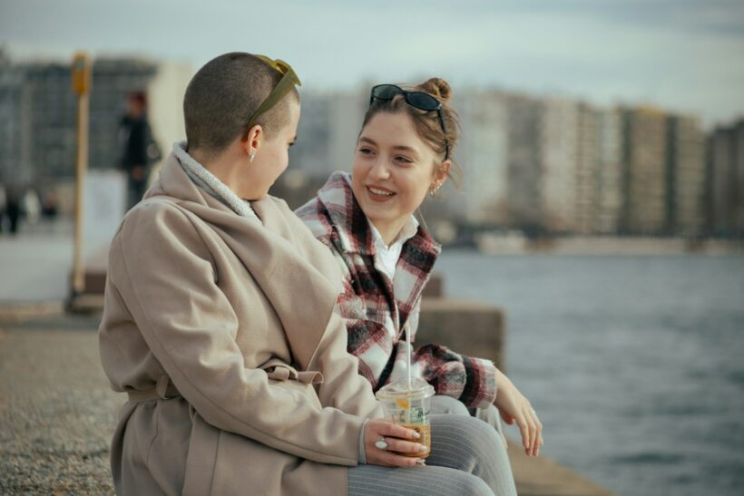 a man and a woman sitting next to each other